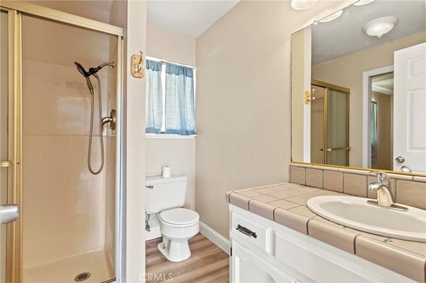 Bathroom, Glass Shower, Interior, Tile Countertops, Wood Texture Flooring
