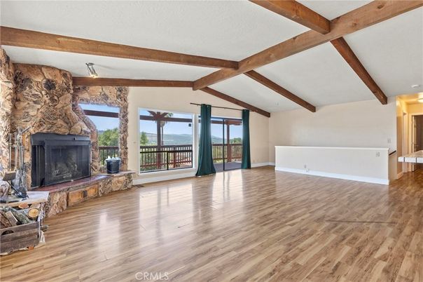 Empty room, Fireplace, Interior, Stone Walls, Wooden Beams, Wood Texture Flooring
