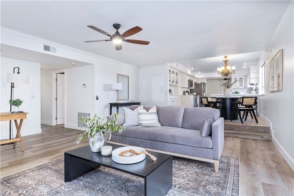 Chandelier, Dining room, Interior, Kitchen, Living room, Stainless Steel Appliances, Wood Texture Flooring