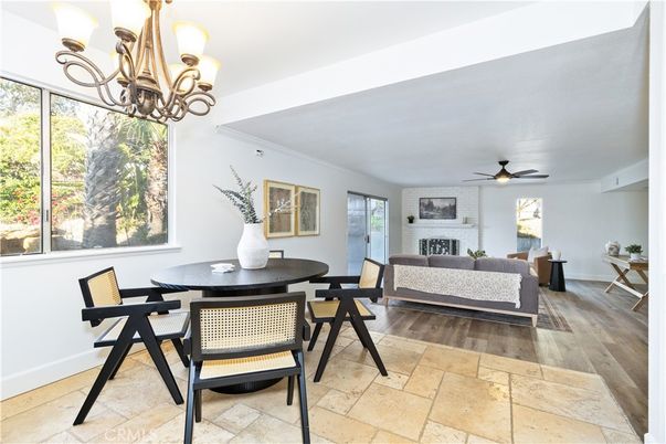 Chandelier, Dining room, Fireplace, Interior, Living room, Stone Walls, Wood Texture Flooring