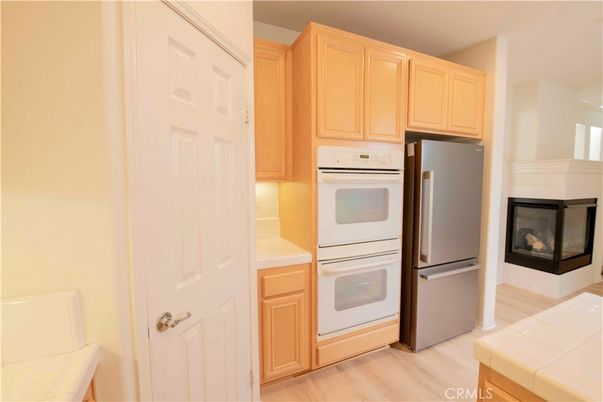 Fireplace, Interior, Kitchen, Tile Countertops, Wood Texture Flooring