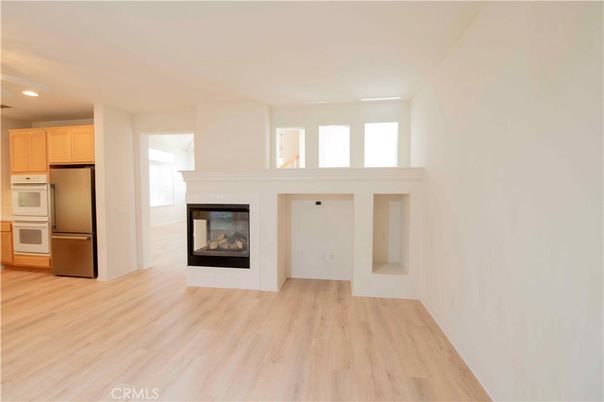 Empty room, Fireplace, Interior, Kitchen, Recessed Lighting, Wood Texture Flooring
