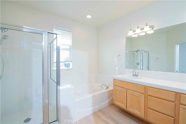 Bathroom, Dual Sink Vanities, Glass Shower, Interior, Recessed Lighting, Wood Texture Flooring