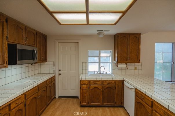 Interior, Kitchen, Tile Countertops, Wood Texture Flooring