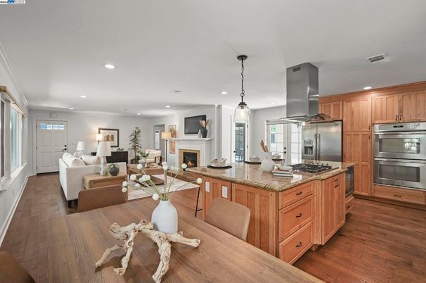Dining room, Fireplace, Interior, Kitchen, Living room, Pendant Lights, Recessed Lighting, Stainless Steel Appliances, Wood Texture Flooring