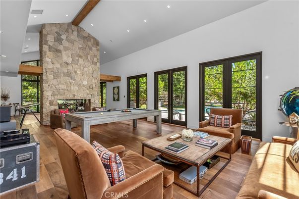 Billiard Table, Fireplace, Game Room, Interior, Living room, Recessed Lighting, Stone Walls, Wooden Beams, Wood Texture Flooring