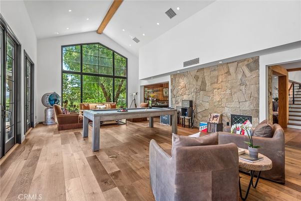 Billiard Table, Fireplace, Game Room, Interior, Living room, Recessed Lighting, Stone Walls, Wooden Beams, Wood Texture Flooring