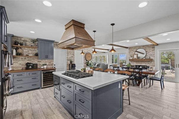 Dining room, Fireplace, Interior, Kitchen, Pendant Lights, Recessed Lighting, Stainless Steel Appliances, Stone Walls, Wooden Beams, Wood Texture Flooring