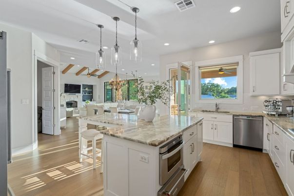 Chandelier, Dining room, Fireplace, Interior, Kitchen, Pendant Lights, Recessed Lighting, Stainless Steel Appliances, Wood Texture Flooring