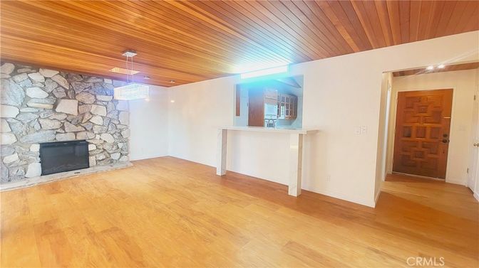Empty room, Fireplace, Interior, Pendant Lights, Stone Walls, Wooden Ceilings, Wood Texture Flooring