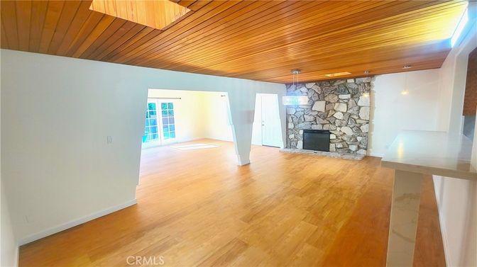 Empty room, Fireplace, Interior, Stone Walls, Wooden Ceilings, Wood Texture Flooring