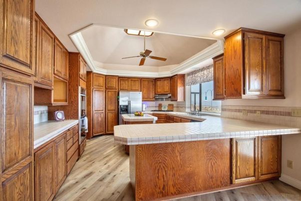 Interior, Kitchen, Recessed Lighting, Tile Countertops, Wood Texture Flooring