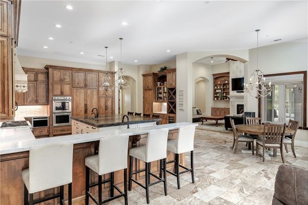 Chandelier, Dining room, Fireplace, Interior, Kitchen, Pendant Lights, Recessed Lighting, Stainless Steel Appliances