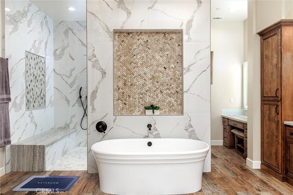 Bathroom, Free Standing Baths, Interior, Marble Walls, Recessed Lighting, Wood Texture Flooring