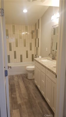 Bathroom, Dual Sink Vanities, Interior, Recessed Lighting, Wood Texture Flooring