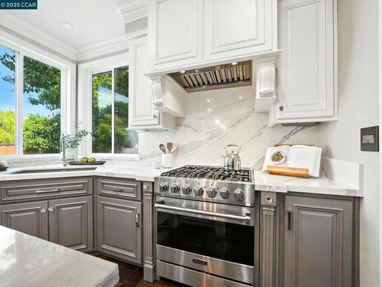 Interior, Kitchen, Marble Walls, Recessed Lighting, Stainless Steel Appliances, Wood Texture Flooring