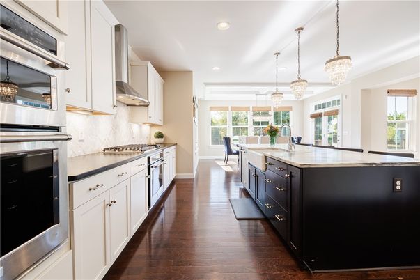 Chandelier, Dining room, Interior, Kitchen, Pendant Lights, Recessed Lighting, Stainless Steel Appliances, Wood Texture Flooring