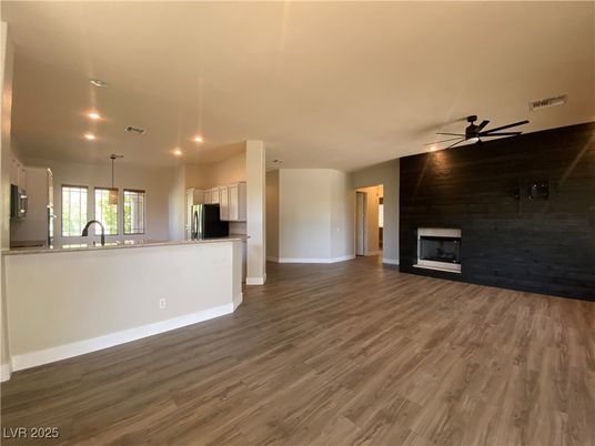 Empty room, Fireplace, Interior, Kitchen, Pendant Lights, Recessed Lighting, Wood Texture Flooring