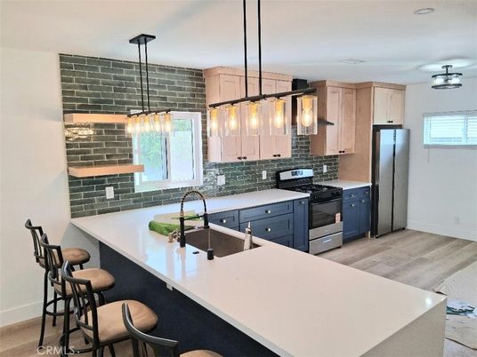 Interior, Kitchen, Pendant Lights, Stainless Steel Appliances, Stone Walls, Wood Texture Flooring
