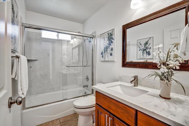 Bathroom, Glass Shower, Interior, Marble Walls, Wood Texture Flooring
