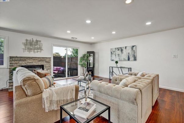 Fireplace, Interior, Living room, Recessed Lighting, Stone Walls, Wood Texture Flooring