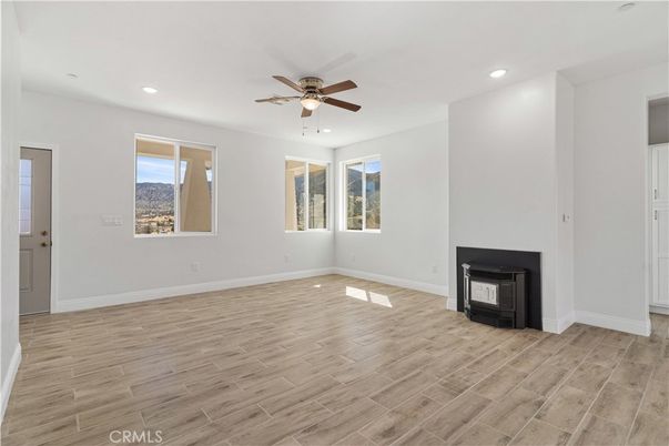 Empty room, Fireplace, Interior, Recessed Lighting, Wood Texture Flooring