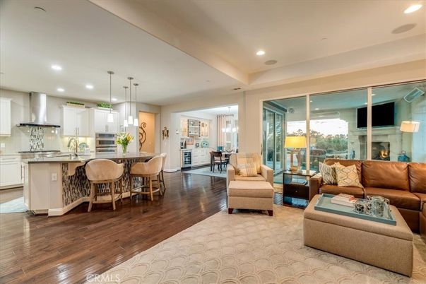 Dining room, Fireplace, Interior, Kitchen, Living room, Pendant Lights, Recessed Lighting, Stainless Steel Appliances, Wood Texture Flooring