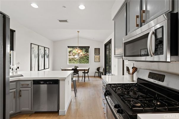 Dining room, Interior, Kitchen, Pendant Lights, Recessed Lighting, Stainless Steel Appliances, Wood Texture Flooring