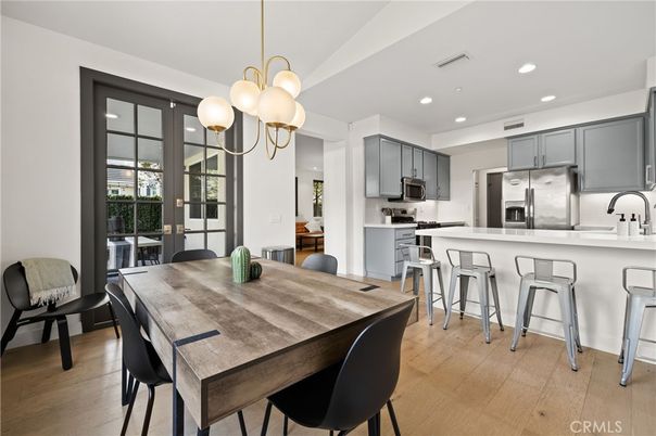 Dining room, Interior, Kitchen, Pendant Lights, Recessed Lighting, Stainless Steel Appliances, Wood Texture Flooring