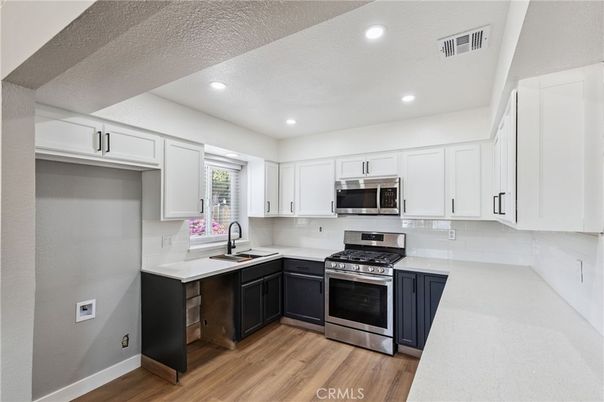 Interior, Kitchen, Recessed Lighting, Stainless Steel Appliances, Wood Texture Flooring