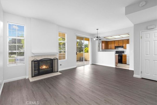 Empty room, Fireplace, Interior, Kitchen, Pendant Lights, Wood Texture Flooring