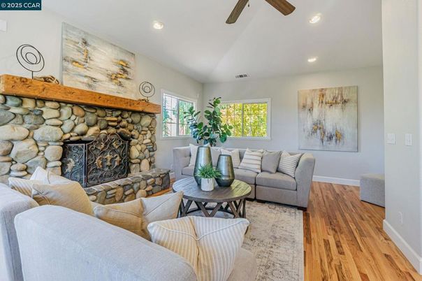Fireplace, Interior, Living room, Recessed Lighting, Stone Walls, Wood Texture Flooring