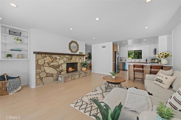 Fireplace, Interior, Kitchen, Living room, Recessed Lighting, Stone Walls, Wood Texture Flooring