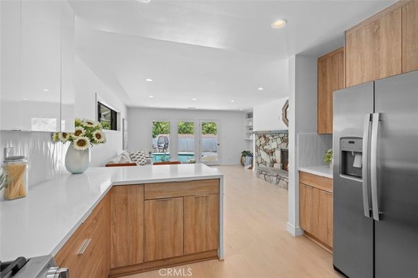 Fireplace, Interior, Kitchen, Recessed Lighting, Stainless Steel Appliances, Stone Walls, Wood Texture Flooring