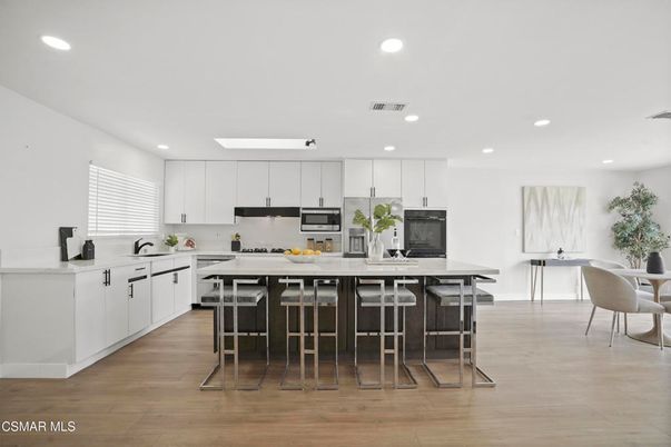 Dining room, Interior, Kitchen, Recessed Lighting, Stainless Steel Appliances, Wood Texture Flooring