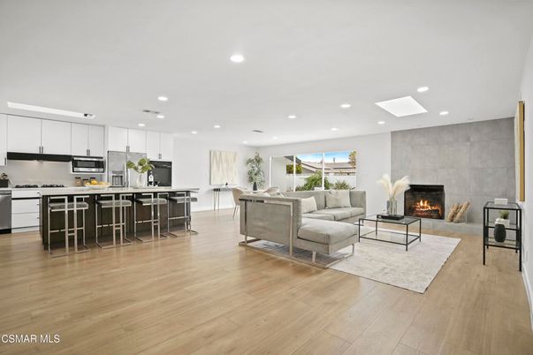 Fireplace, Interior, Kitchen, Living room, Pendant Lights, Recessed Lighting, Stainless Steel Appliances, Wood Texture Flooring