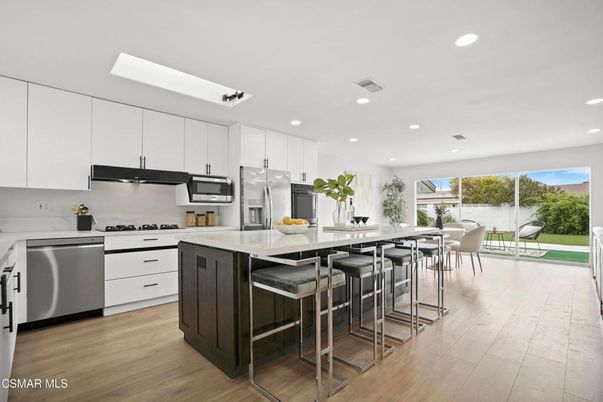 Dining room, Interior, Kitchen, Recessed Lighting, Stainless Steel Appliances, Wood Texture Flooring