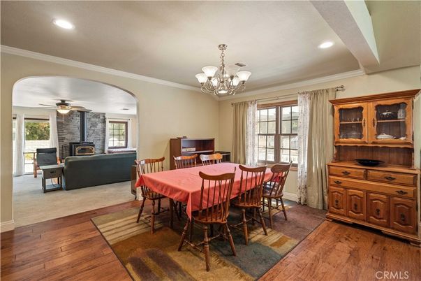 Chandelier, Dining room, Fireplace, Interior, Living room, Recessed Lighting, Stone Walls, Wood Texture Flooring