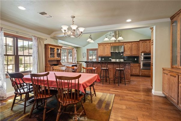 Chandelier, Dining room, Interior, Kitchen, Recessed Lighting, Stainless Steel Appliances, Wood Texture Flooring