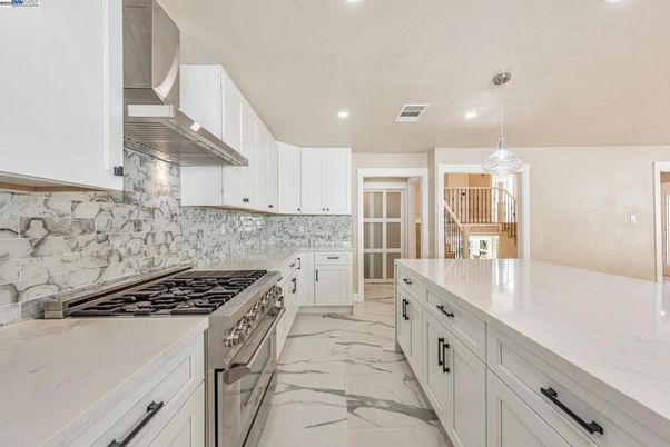 Interior, Kitchen, Marble, Marble Walls, Pendant Lights, Recessed Lighting, Stainless Steel Appliances