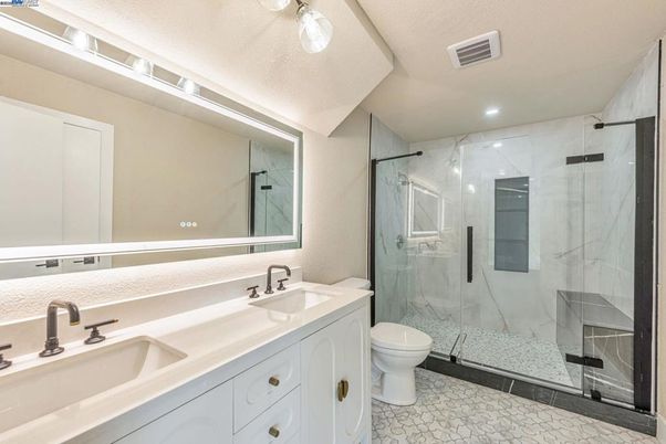 Bathroom, Dual Sink Vanities, Glass Shower, Interior, Marble Walls, Recessed Lighting
