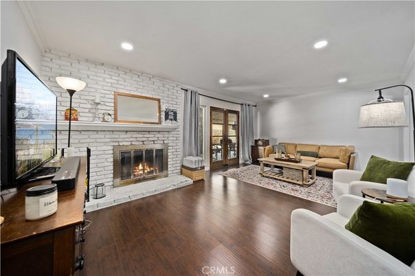 Fireplace, Interior, Living room, Recessed Lighting, Stone Walls, Wood Texture Flooring