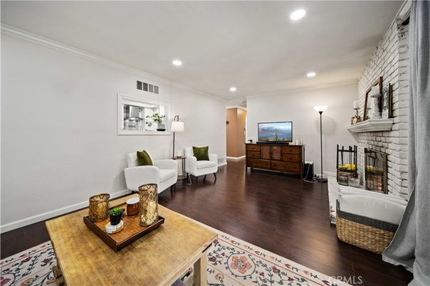 Fireplace, Interior, Living room, Recessed Lighting, Stone Walls, Wood Texture Flooring