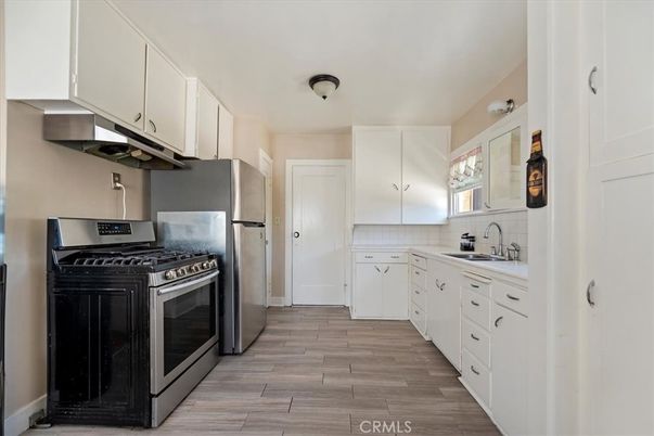 Interior, Kitchen, Stainless Steel Appliances, Tile Countertops, Wood Texture Flooring