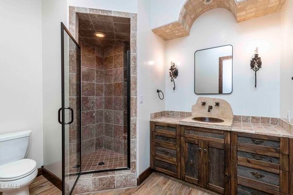 Bathroom, Glass Shower, Interior, Recessed Lighting, Tile Countertops, Wood Texture Flooring