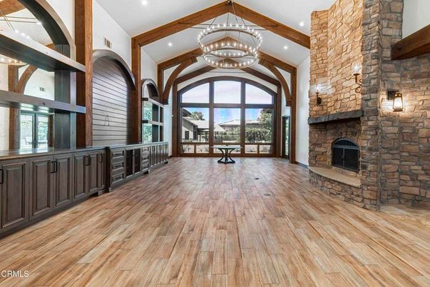 Chandelier, Fireplace, Interior, Pendant Lights, Recessed Lighting, Stone Walls, Wooden Beams, Wood Texture Flooring