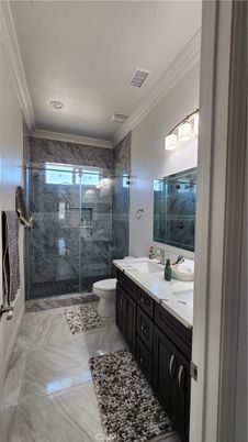 Bathroom, Dual Sink Vanities, Glass Shower, Interior, Marble, Marble Walls, Recessed Lighting