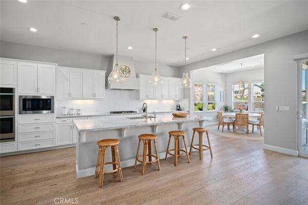 Dining room, Interior, Kitchen, Pendant Lights, Recessed Lighting, Stainless Steel Appliances, Wood Texture Flooring