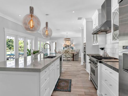 Chandelier, Dining room, Interior, Kitchen, Living room, Pendant Lights, Recessed Lighting, Stainless Steel Appliances, Wood Texture Flooring