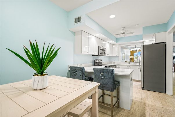 Dining room, Interior, Kitchen, Recessed Lighting, Stainless Steel Appliances, Wood Texture Flooring